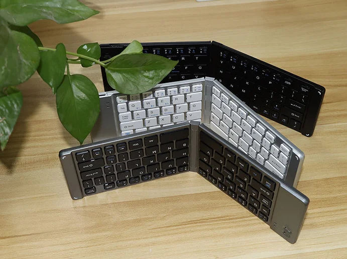 2025 new Blue tooth ultra-thin mini foldable rechargeable phone, tablet, computer keyboard